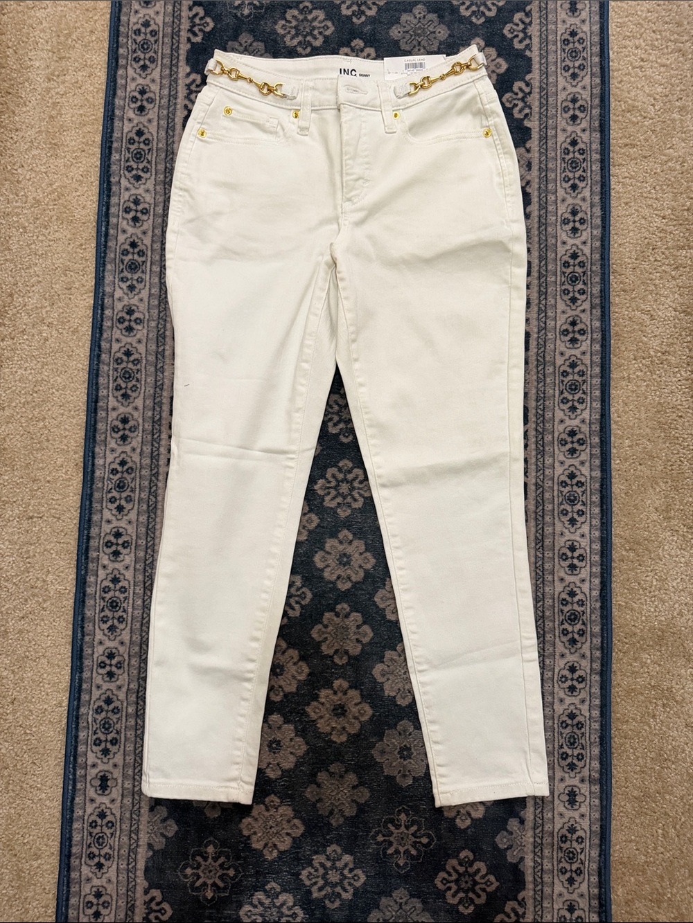 INC International Concepts White Skinny Jeans with Gold Chain Waist Detail